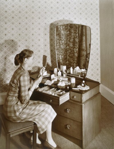 Woman at Her Dressing Table, c.1955 by English Photographer
